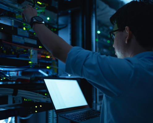 Computer Engineer Is Setting Up Network In Server Room